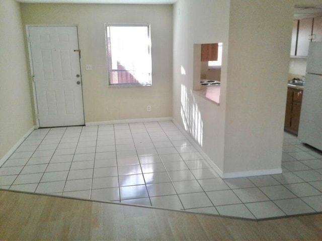 entrance foyer featuring light tile patterned floors