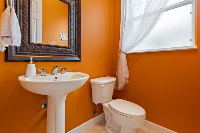 bathroom with tile patterned flooring and toilet