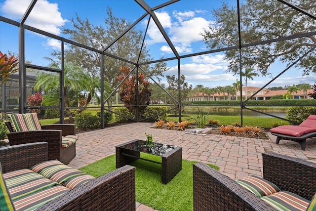 view of patio featuring outdoor lounge area and glass enclosure