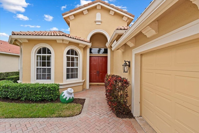 doorway to property featuring a garage