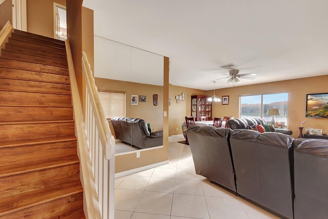 tiled living room featuring ceiling fan