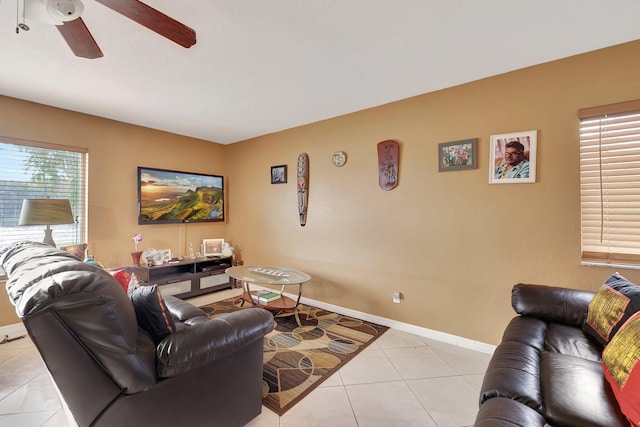 tiled living room featuring ceiling fan