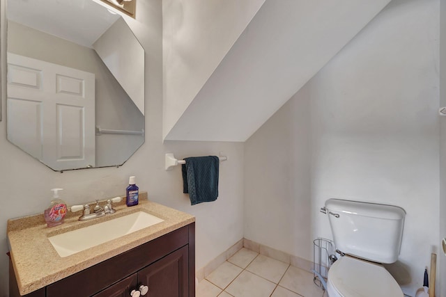 bathroom with tile patterned floors, vanity, and toilet