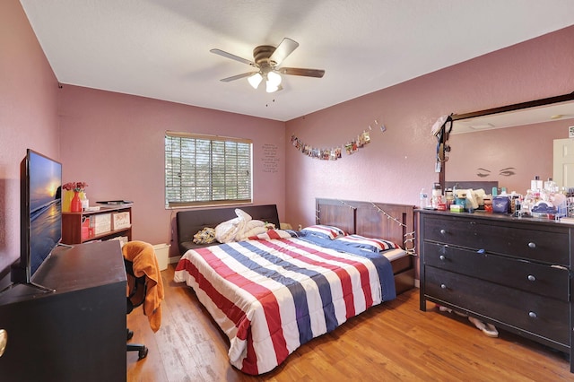 bedroom featuring ceiling fan and light hardwood / wood-style floors