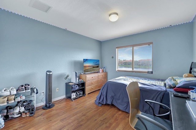 bedroom featuring wood-type flooring