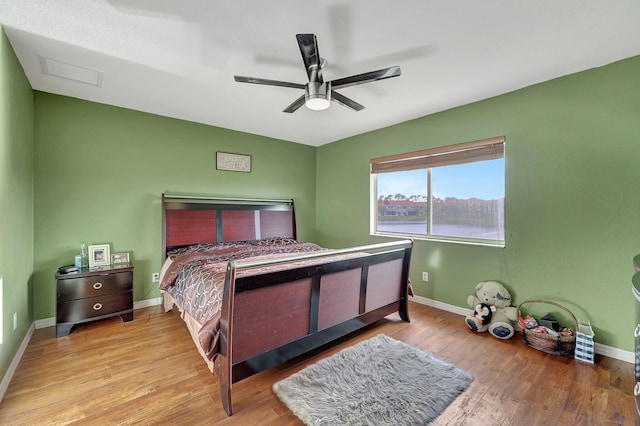 bedroom featuring light hardwood / wood-style floors and ceiling fan