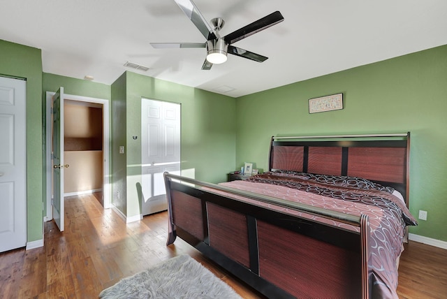 bedroom with ceiling fan and light wood-type flooring