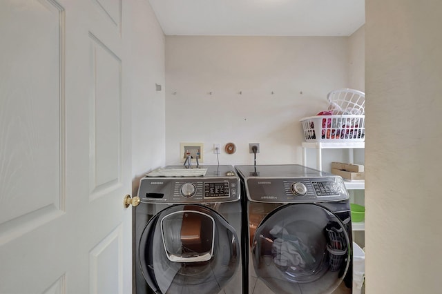 laundry area with washing machine and dryer