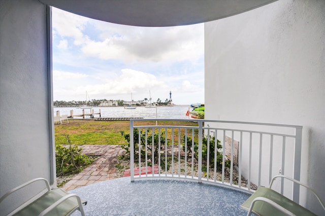 balcony featuring a water view