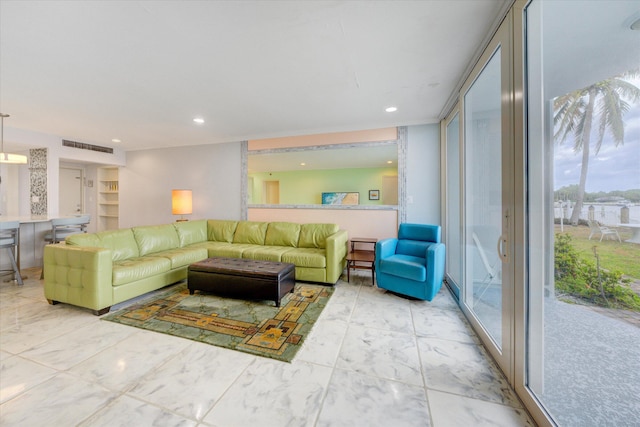 living room with floor to ceiling windows