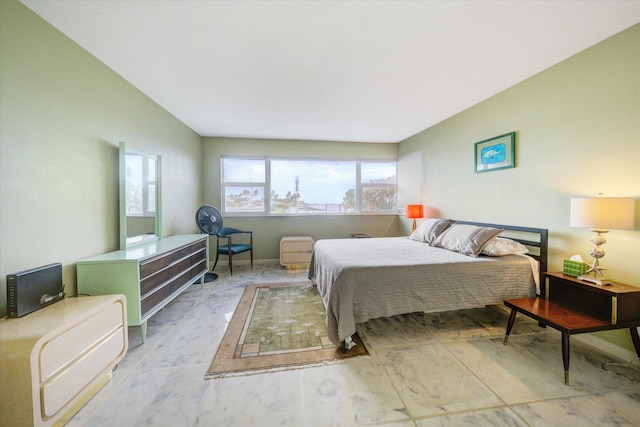 bedroom featuring multiple windows