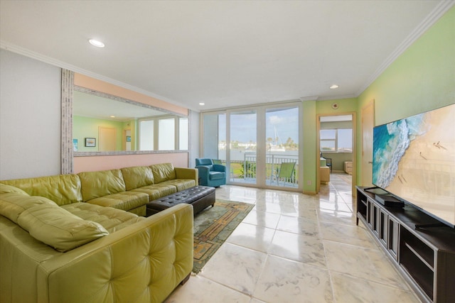 living room with ornamental molding and floor to ceiling windows