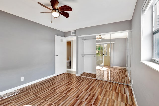 unfurnished bedroom featuring a closet and ceiling fan