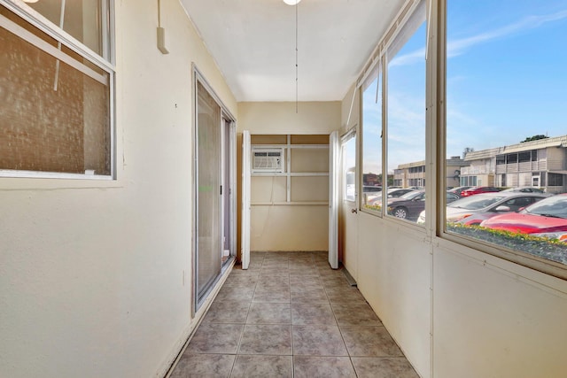 hallway featuring light tile patterned flooring