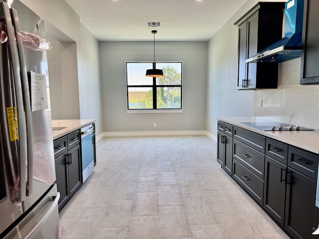 13200 SE US Highway 441, Okeechobee, FL 34974 - kitchen featuring stainless steel appliances, wall chimney range hood, light countertops, and pendant lighting
