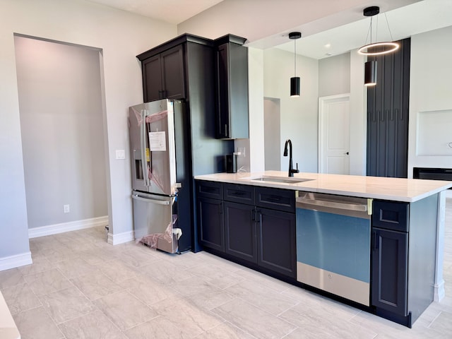 13200 SE US Highway 441, Okeechobee, FL 34974 - kitchen featuring appliances with stainless steel finishes, a sink, a peninsula, and baseboards