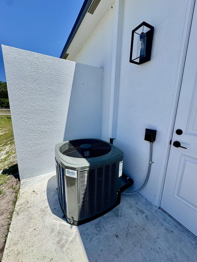 13200 SE US Highway 441, Okeechobee, FL 34974 - exterior view of cooling unit and stucco siding