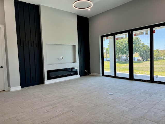 13200 SE US Highway 441, Okeechobee, FL 34974 - unfurnished living room featuring baseboards