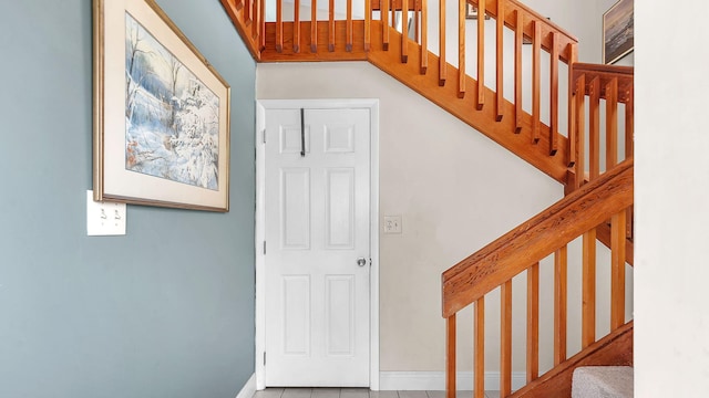 staircase with tile patterned flooring