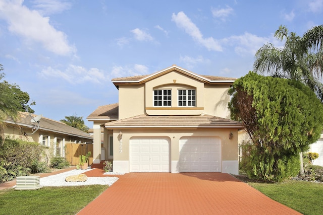 mediterranean / spanish house featuring a garage