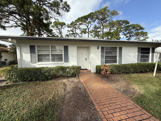 ranch-style home with a front yard