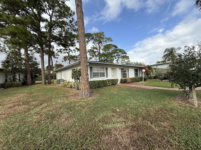 ranch-style house with a front lawn