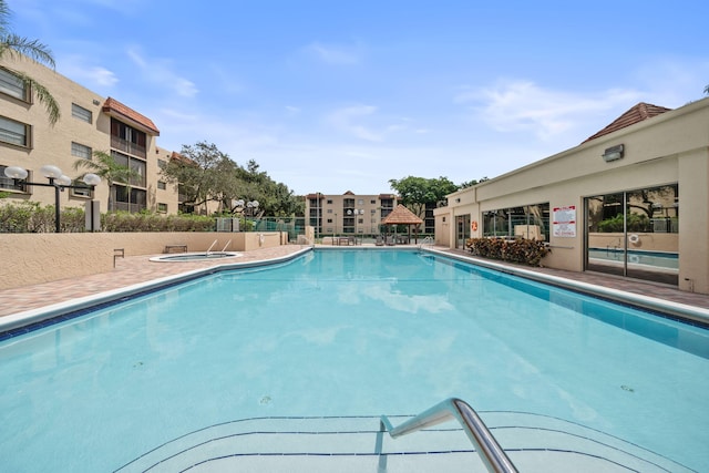 view of pool featuring a hot tub