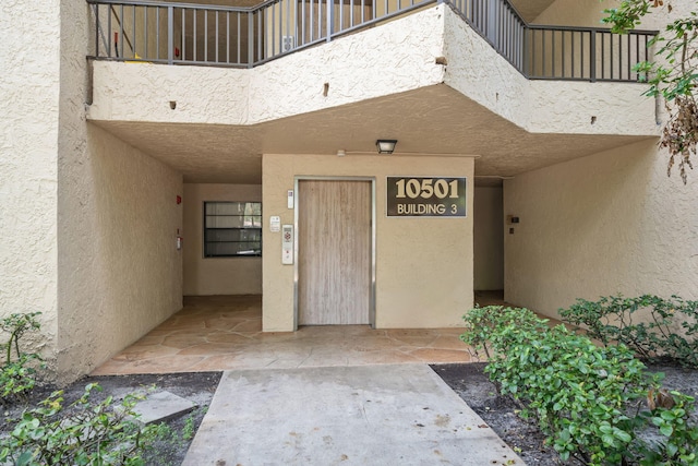 property entrance with a balcony