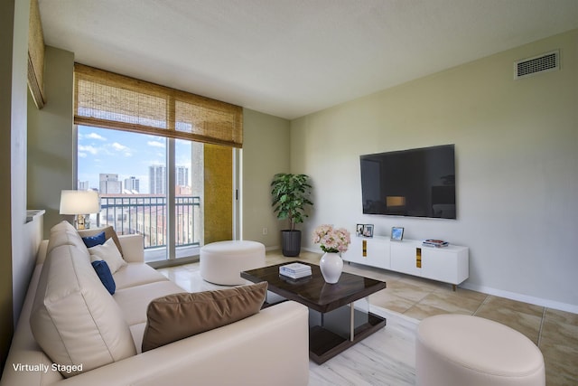 living room with light tile patterned flooring