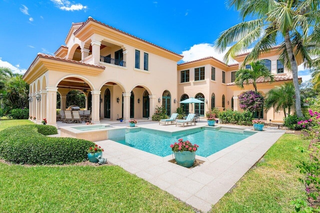 view of pool featuring an in ground hot tub and a patio area