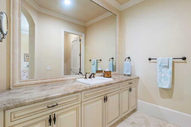 bathroom with vanity and ornamental molding