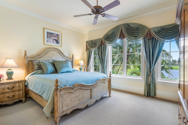 bedroom featuring light colored carpet, ceiling fan, and crown molding