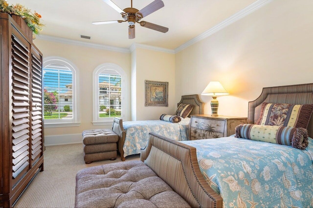 bedroom with ceiling fan, crown molding, and light colored carpet