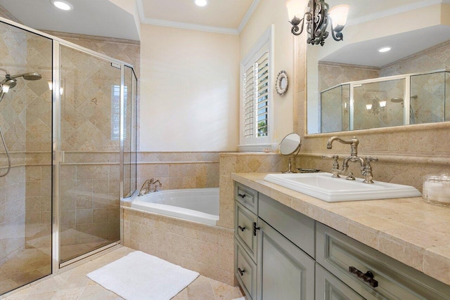 bathroom with shower with separate bathtub, vanity, ornamental molding, and a notable chandelier