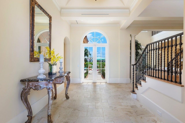 entrance foyer with coffered ceiling, french doors, crown molding, ornate columns, and beamed ceiling