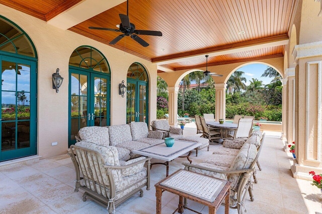 view of patio featuring ceiling fan, an outdoor hangout area, and french doors