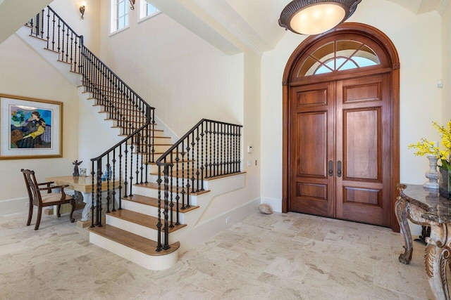 entrance foyer featuring a high ceiling