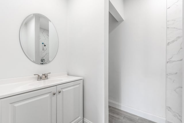 bathroom with vanity and hardwood / wood-style flooring