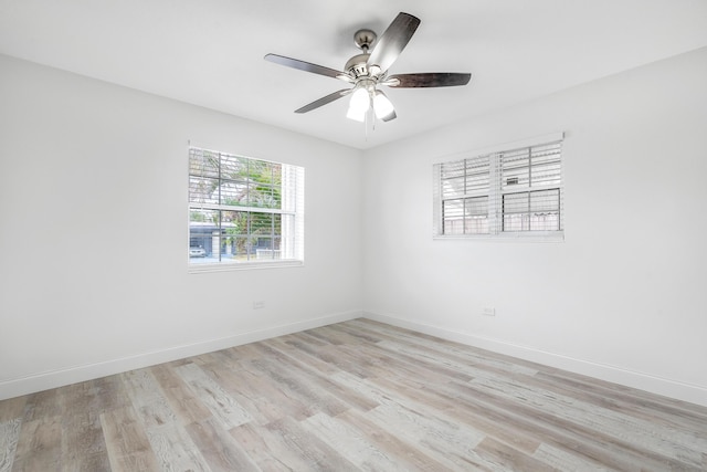 unfurnished room featuring ceiling fan and light hardwood / wood-style flooring