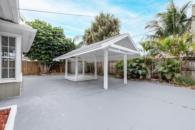 view of patio with a storage shed