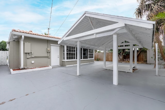 exterior space with a carport