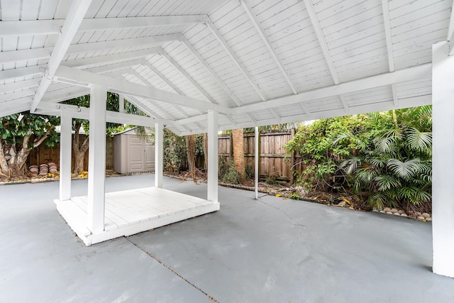 view of patio / terrace featuring a storage unit