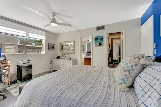 bedroom with ceiling fan and ensuite bath