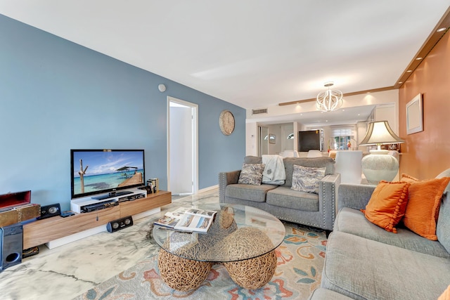 living area with visible vents and an inviting chandelier