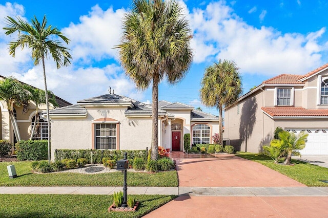 mediterranean / spanish-style house featuring a garage