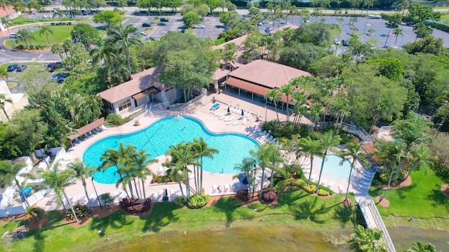 birds eye view of property with a water view