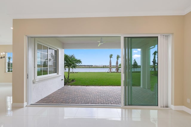 doorway with ceiling fan with notable chandelier, a water view, light tile patterned floors, and crown molding