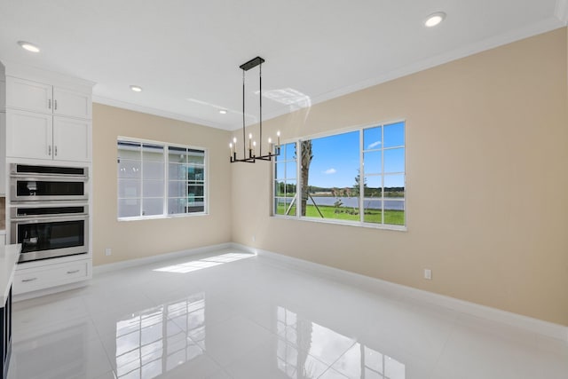 unfurnished dining area featuring a notable chandelier, light tile patterned floors, and ornamental molding