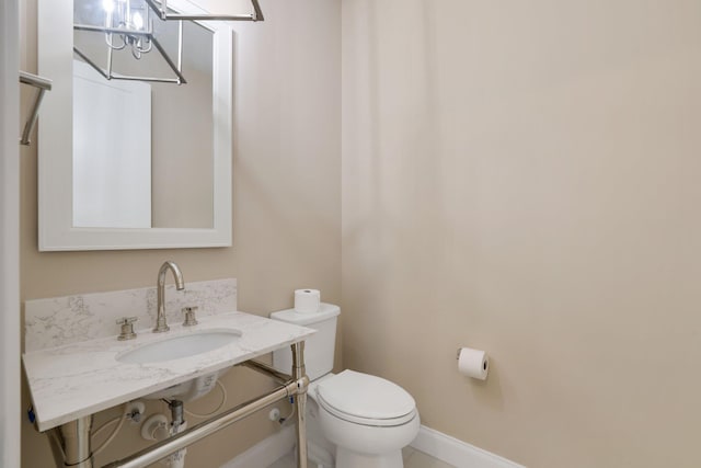 bathroom with sink and toilet