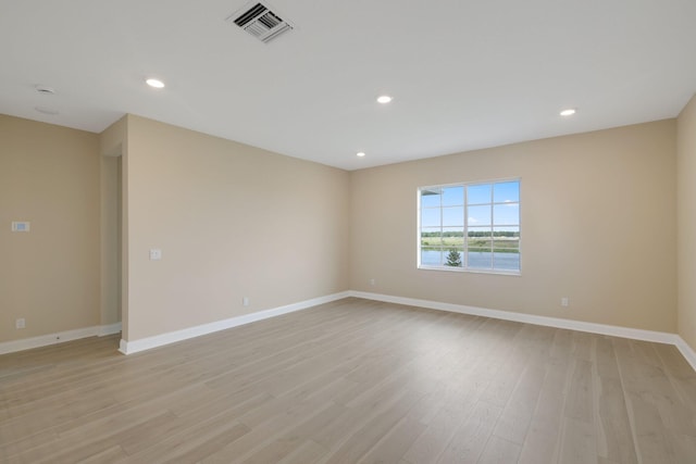 spare room with light wood-type flooring